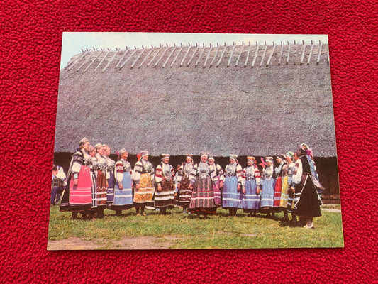 Estonian Dance And Song Festival postcard - Folk Singers in Estonian Folk Dresses in front of old farm house - 1975 - unused